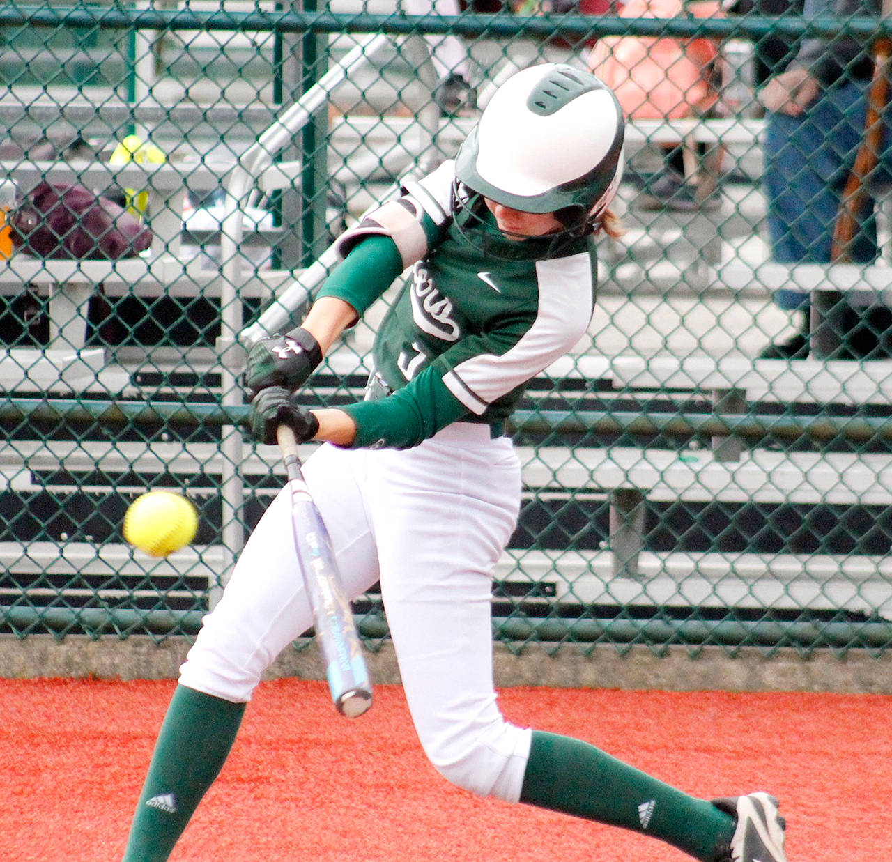 Port Angeles’ Zoe Smithson barrels up bat to ball for a hit during the Roughriders’ 15-6 district win over Fife on Friday at the Regional Athletic Center in Lacey. Port Angeles qualified for state with the win. Mark Krulish/Kitsap News Group