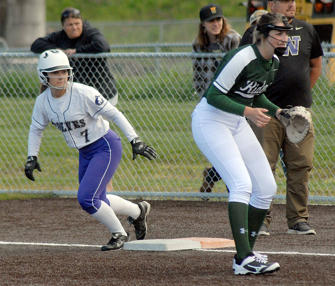 Sequim’s Isabelle Dennis, left, prepares to leave first base during a recent game against Port Angeles.                                Keith Thorpe/Peninsula Daily News