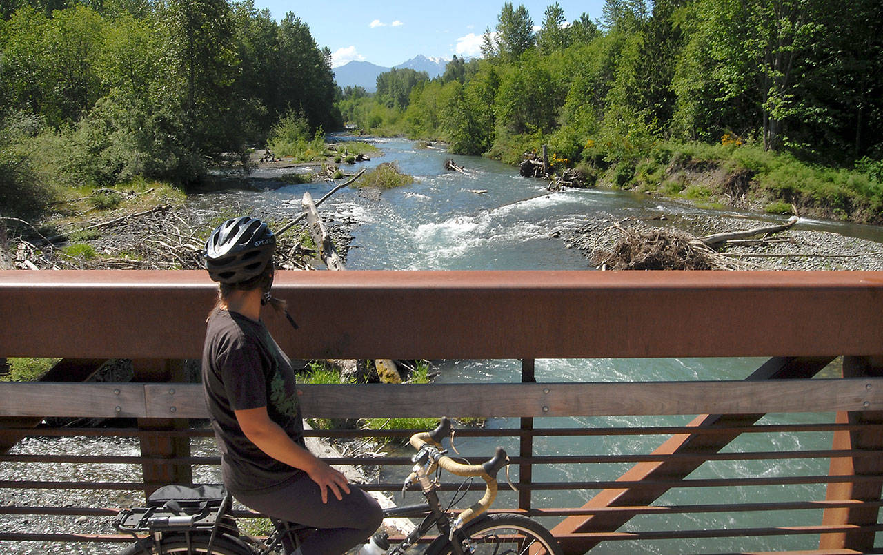 Ivy Phillips of Angew pauses to admire the view of the Dungeness River from the trestle at Railroad Bridge Park in Sequim on Thursday. (Keith Thorpe/Peninsula Daily News)
