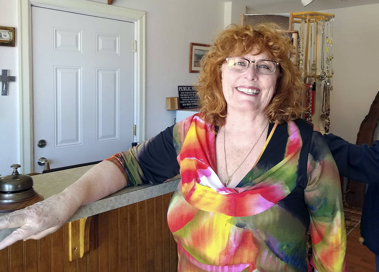 Jeanette Gossard is shown in the Bee’s Knee’s Boutique in Port Angeles. (Denise Buchner/Peninsula Daily News)