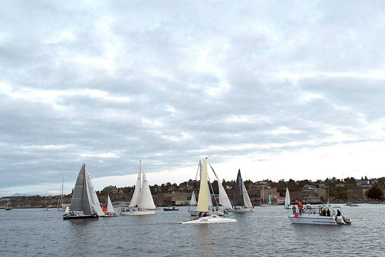 The Race Committee Boat signals the start of the 2018 R2AK in Port Townsend Bay with a blast of its horn. (Jeannie McMacken/Peninsula Daily News)