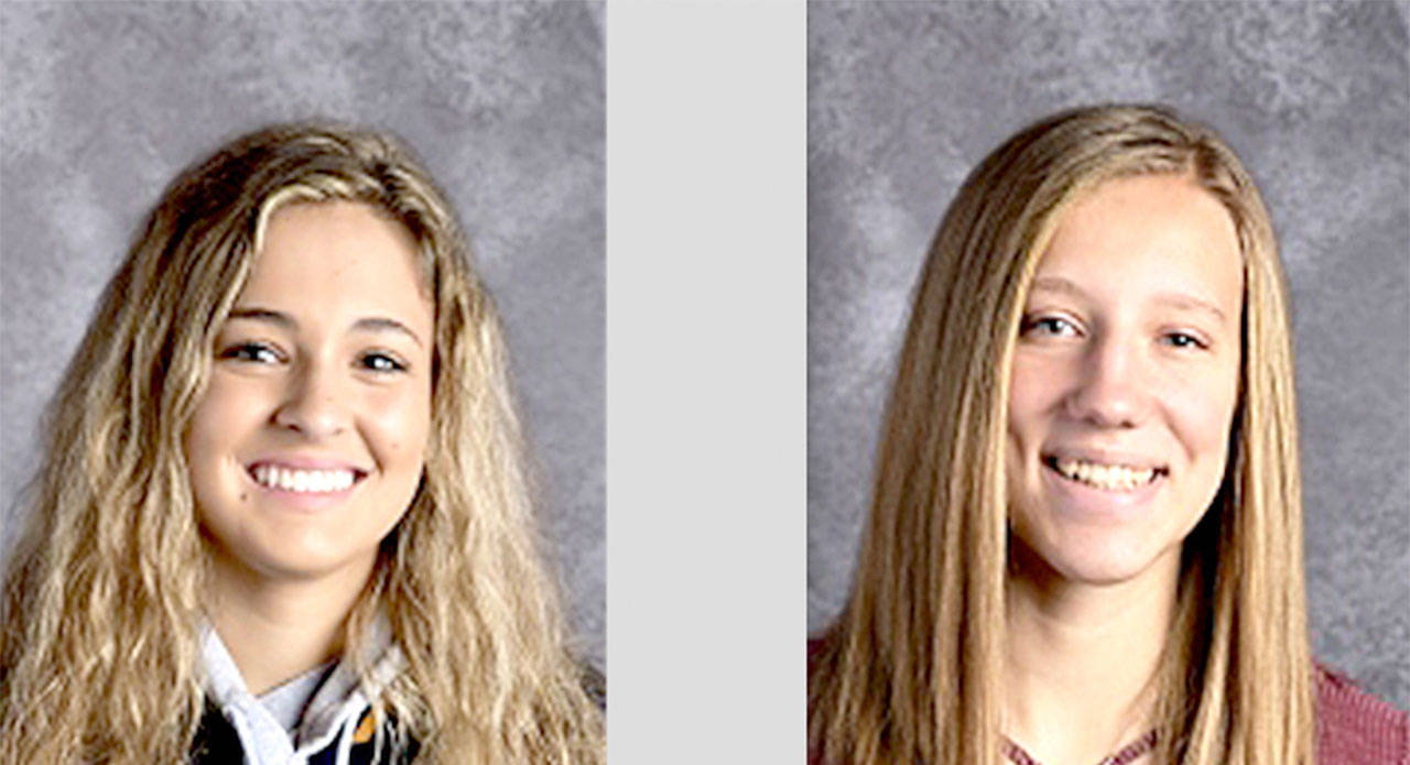 Brittney Dean, left and Chloe Leverington of the Forks softball team.