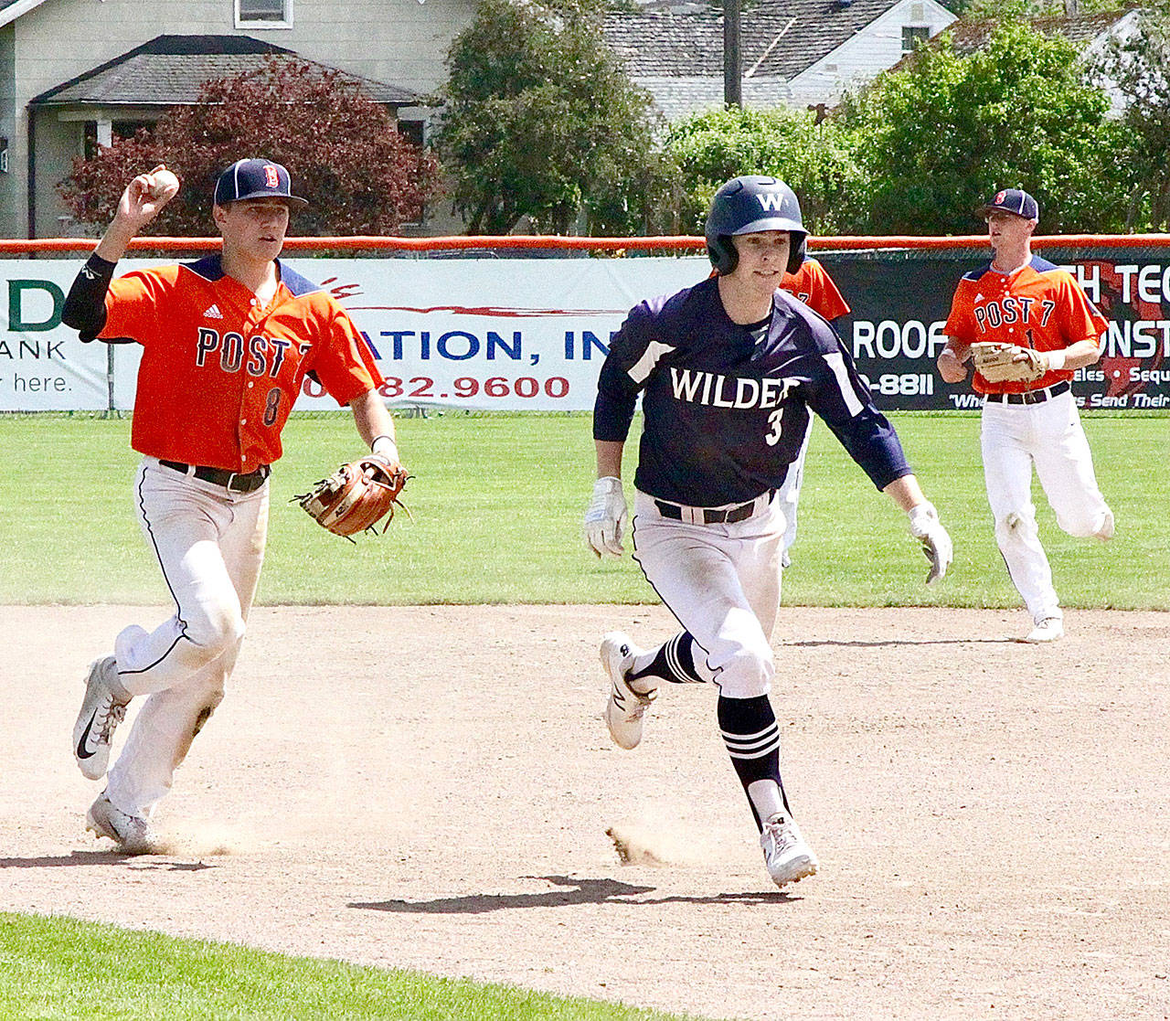 Dave Logan/for Peninsula Daily News Wilder’s Milo Whitman gets caught in a rundown against Bellingham Post No. 7 on Sunday at Civic Field. Whitman had a walkoff hit in the bottom of the seventh inning to help Wilder beat Bellingham 3-2. Wilder also won the second half of a doubleheader 12-2.