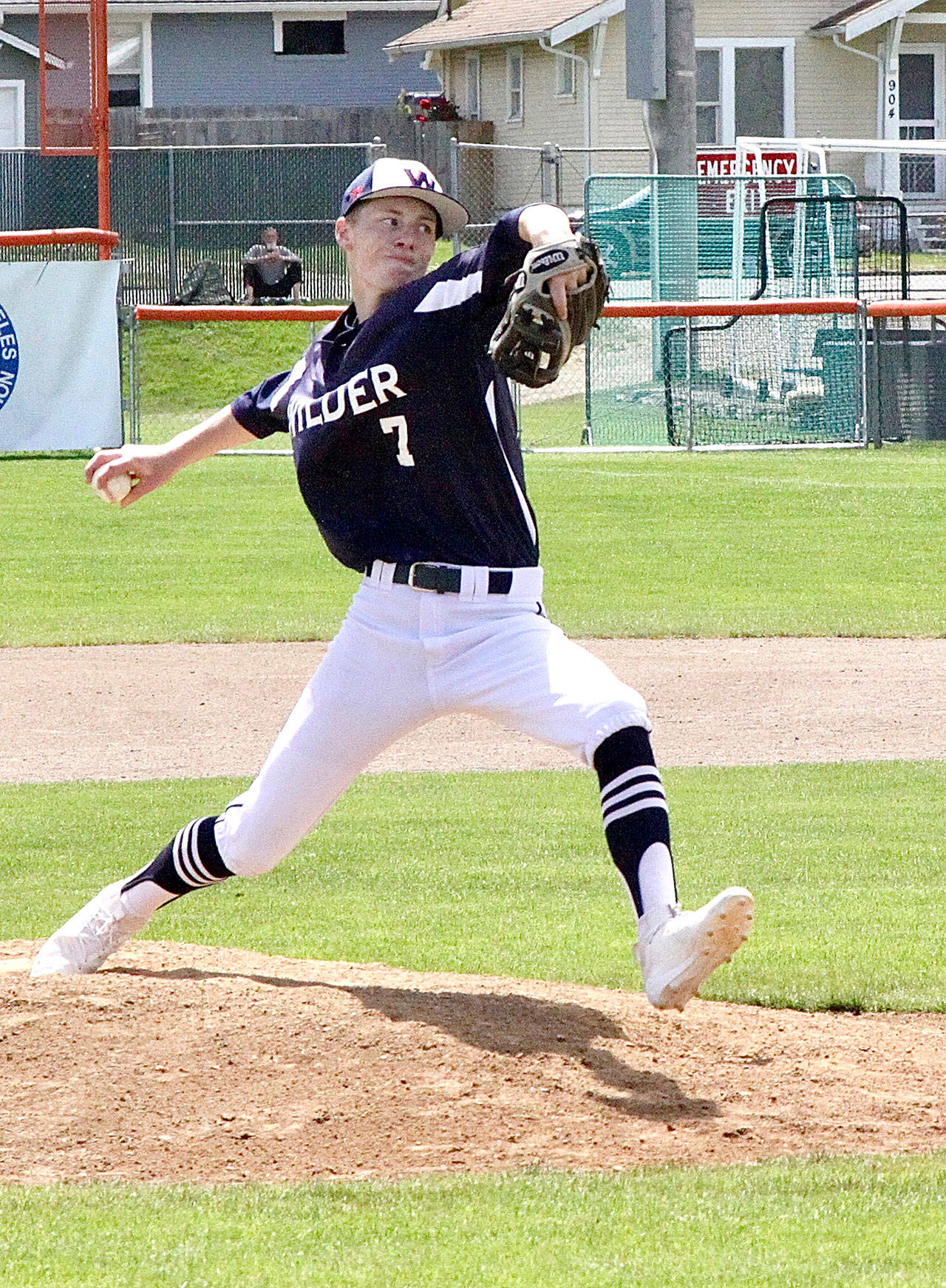 Dave Logan/for Peninsula Daily News Wilder’s Hayden Woods delivers a pitch to the plate against Bellingham on Sunday at Civic Field.