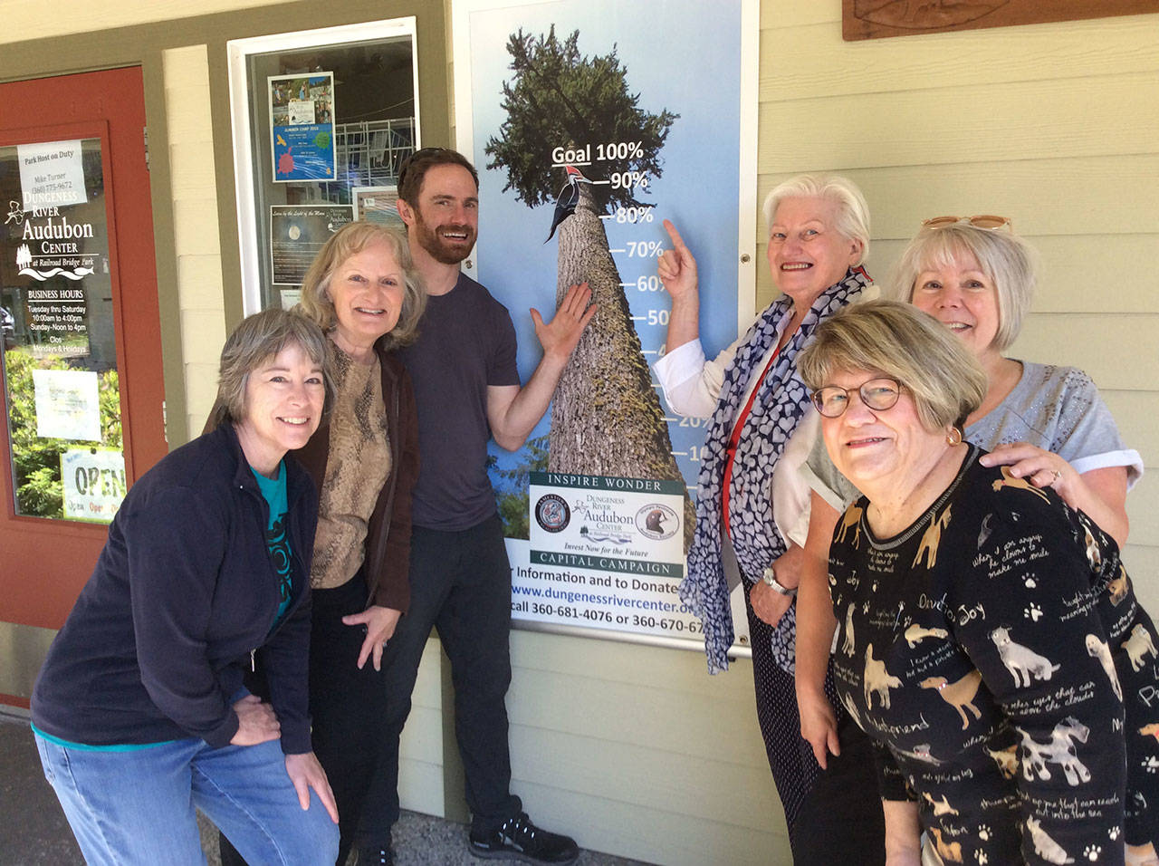 Representatives of the volunteer Capital Campaign Committee raising funds for the proposed Dungeness River Audubon Center expansion include, from left, Darcy McNamara, chair Annette Hanson, center Director Powell Jones, Kendra Donelson, Wanda Schneider and Tuttie Peetz. They are seen here in front of the “Inspire Wonder Capital Campaign” banner — now at about 90 percent (as marked by the woodpecker) of the approximate $3.6 million goal after recently receiving word of a $1.5 grant through a state capital budget appropriation.