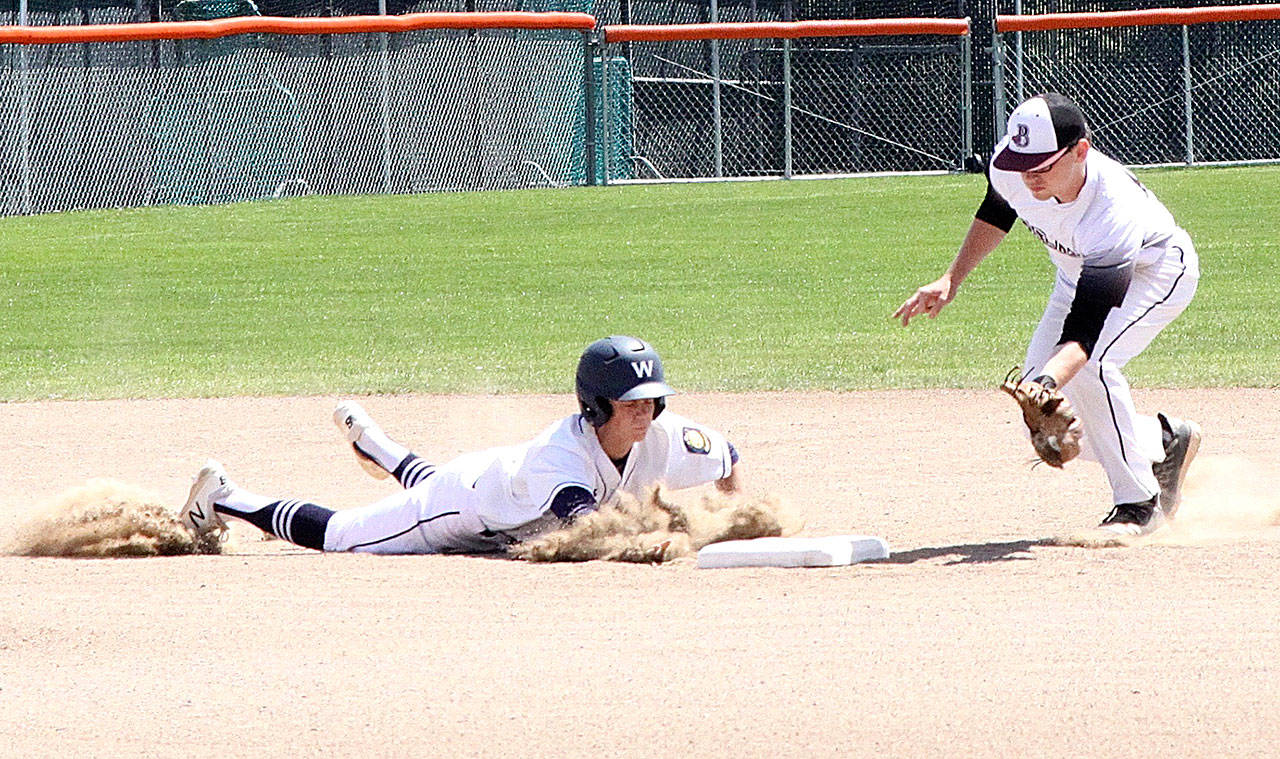 Wilder’s Joel Wood slides safely into second base as he avoids the tag of the Blaze shortstop Brandon Kimball. Wood had three doubles in the doubleheader Sunday. (Dave Logan/for Peninsula Daily News)