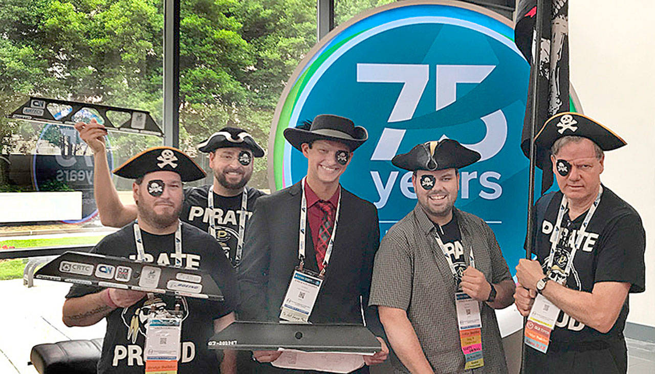 From left, Peninsula College Advanced Manufacturing students Jason Lebeck, Adam Jordan, Emerson Stipes and Colin Kahler join faculty advisor James Russell at the 75th SAMPE Convention in Charlotte, N.C. The students teamed up to place third in the international Student Bridge Competition, and PC’s other teams took seventh and ninth out of 24 teams. (Peninsula College)
