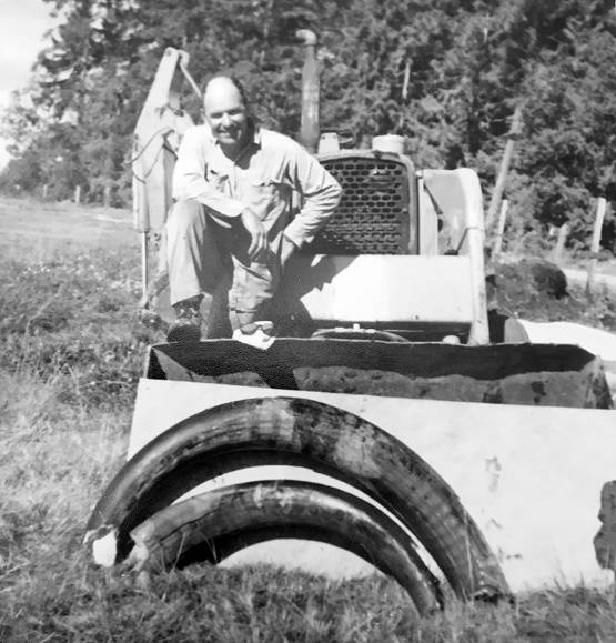 Clare Manis Hatler Emanuel Manis is pictured and the two mastodon tusks shortly after he unearthed them on his farm near Sequim on Aug. 8, 1977.