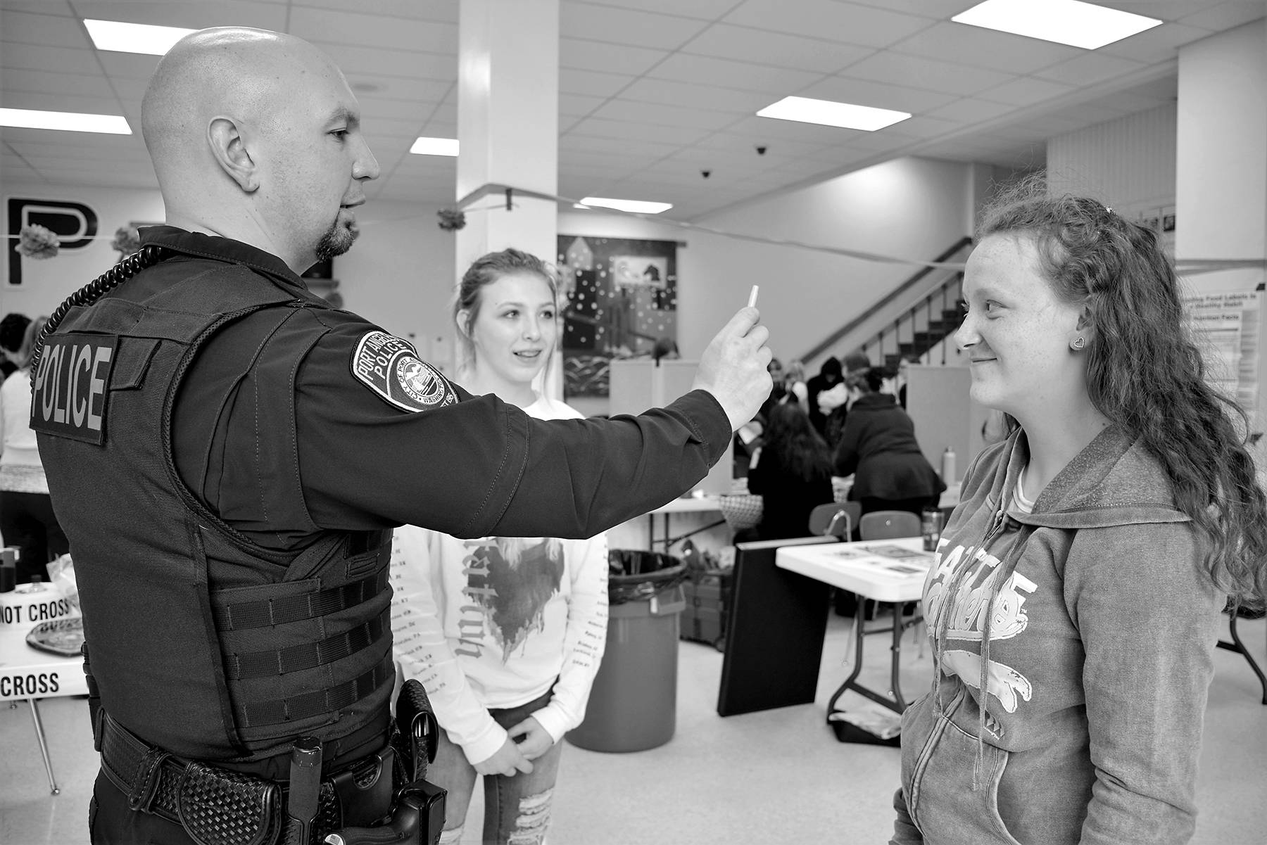 <strong>Patsene Dashiell</strong>/Port Angeles School District Port Angeles Police Department School Resource Officer Jeff Ordona walks sophomore Jaden Gadbaw through a standardized field sobriety test as sophomore Lylli Woods looks on.