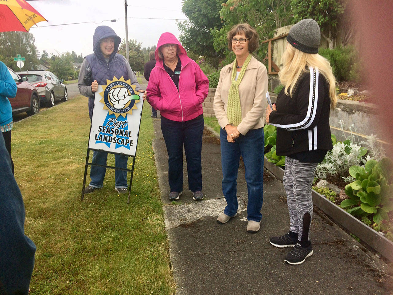From left, are garden club members Leiann Niccoli and Mary Jacoby with Green Thumb award recipient Andrea Grzabka and Green Thumb committee chair Jan Anglin,