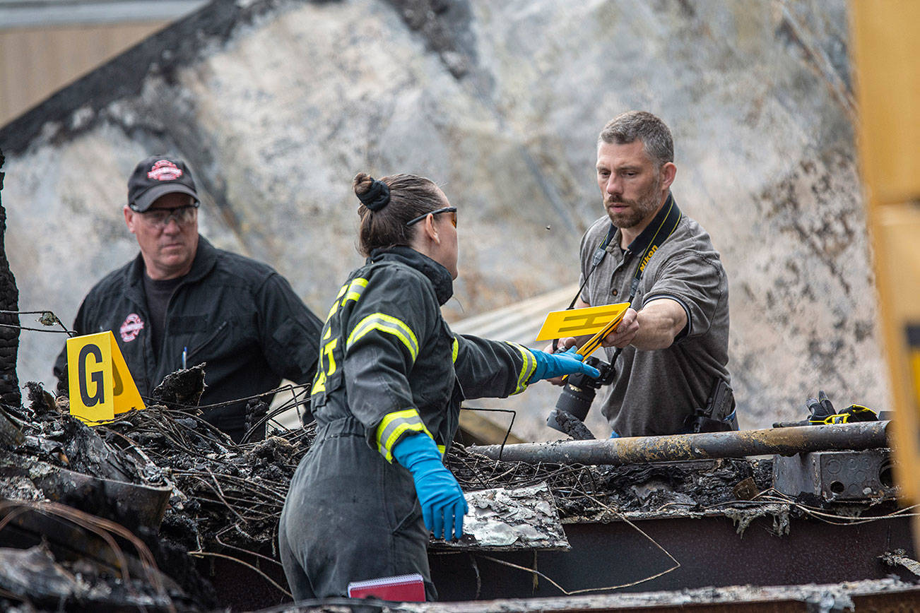 Investigators continue search for evidence in killing of woman, three children