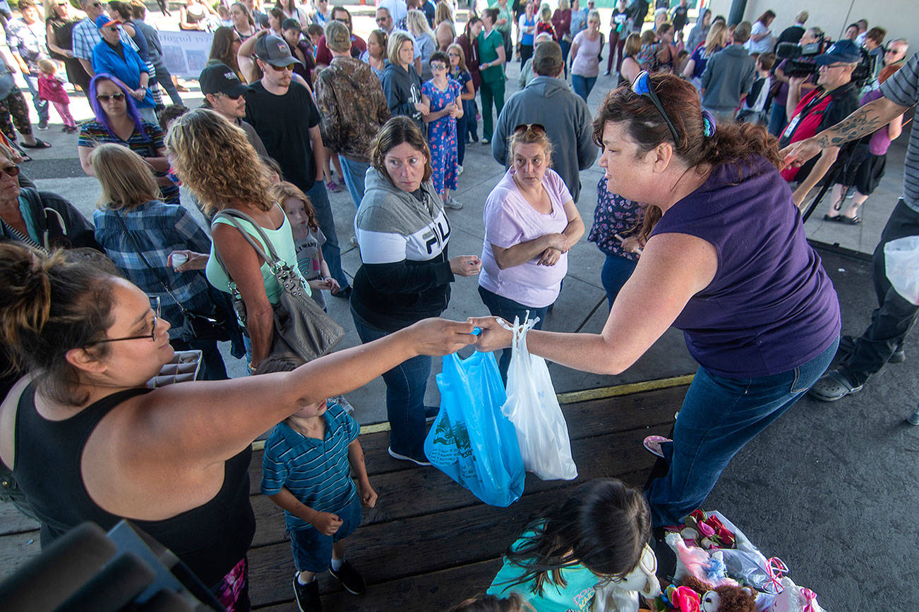 More than 100 mourn Port Angeles woman, her children at City Pier vigil