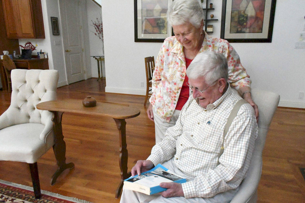 Jean and Steve Reed remember the Apollo missions and reminisce about their time with the USGS and NASA. Steve said he was part of a team the trained astronauts to identify rock samples and a geologist who determined their composition. Jean documented the rock samples through photographs. The couple is hoping for clear skies Saturday for the 50th anniversary of the first moon landing. (Jeannie McMacken/Peninsula Daily News)