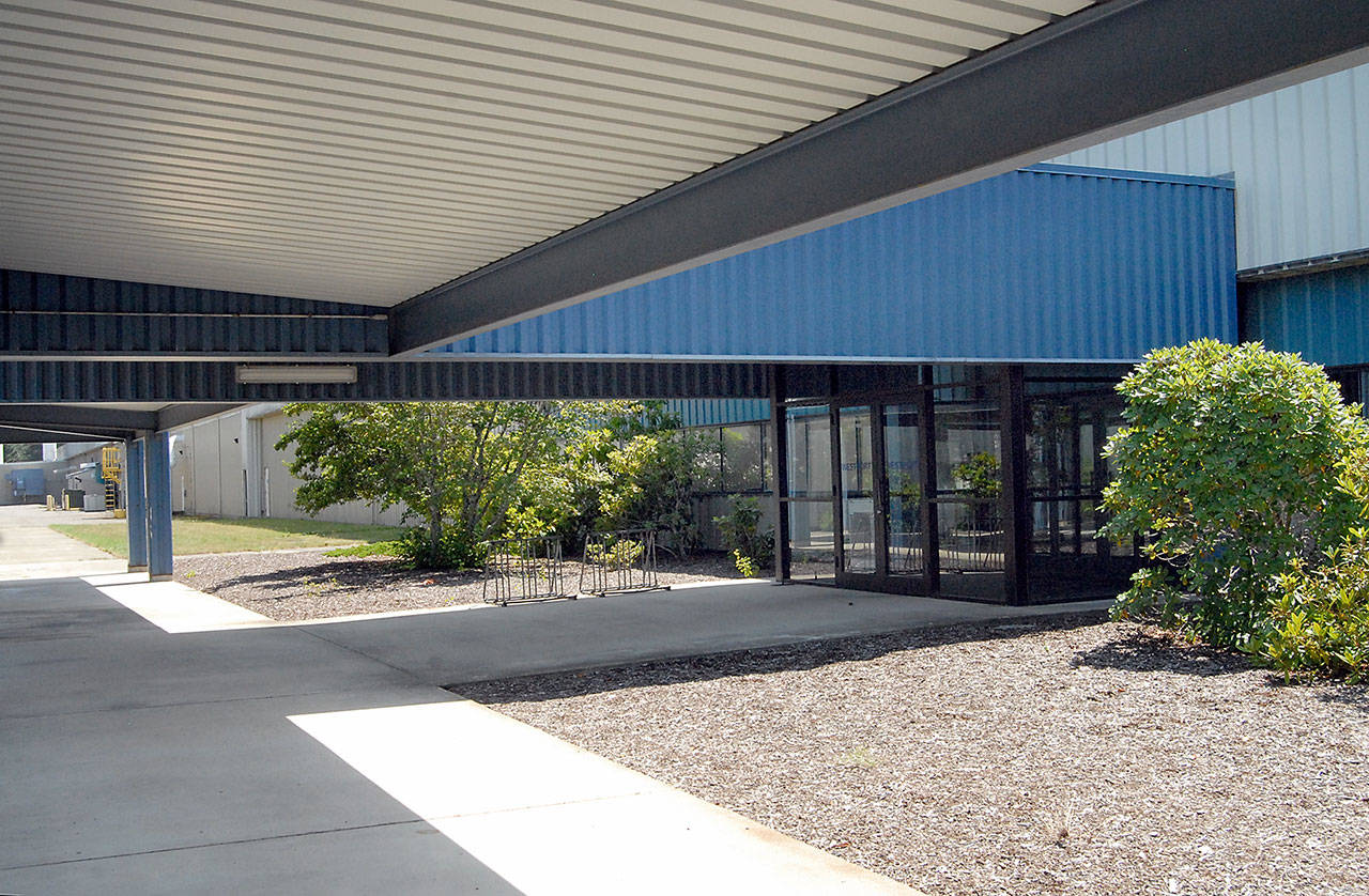 The Port of Port Angeles’ 1010 Building near William R. Fairchild International Airport in Port Angeles, which formerly housed a furniture-making shop for Westport Yachts, is being considered as a potential home to the Peninsula Communications 9-1-1 dispatch center and an emergency operations center for Clallam County. (Keith Thorpe/Peninsula Daily News)