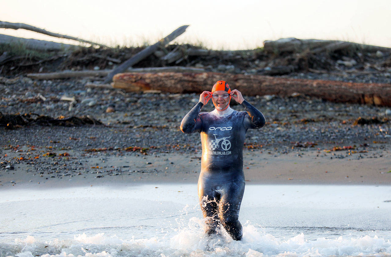 Rob DeCou starts from Dungeness Spit in his bid to swim across the Strait of Juan de Fuca in a wetsuit on Saturday. (Luke Rafferty)