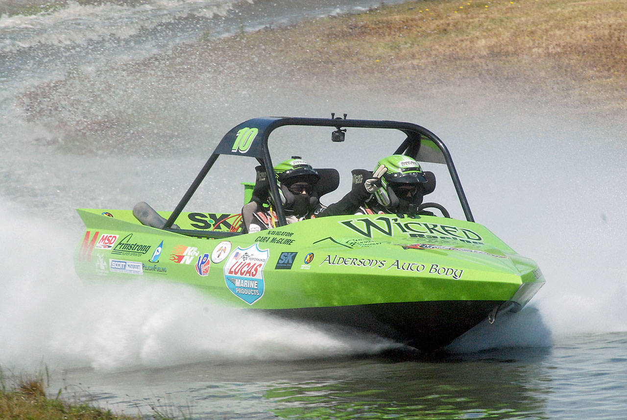 Keith Thorpe/Peninsula Daily News Port Angeles-based Wicked Racing’s boat piloted by Dan Morrison and navigated by Cara McGuire makes it way around the course during a qualifying race on Saturday.