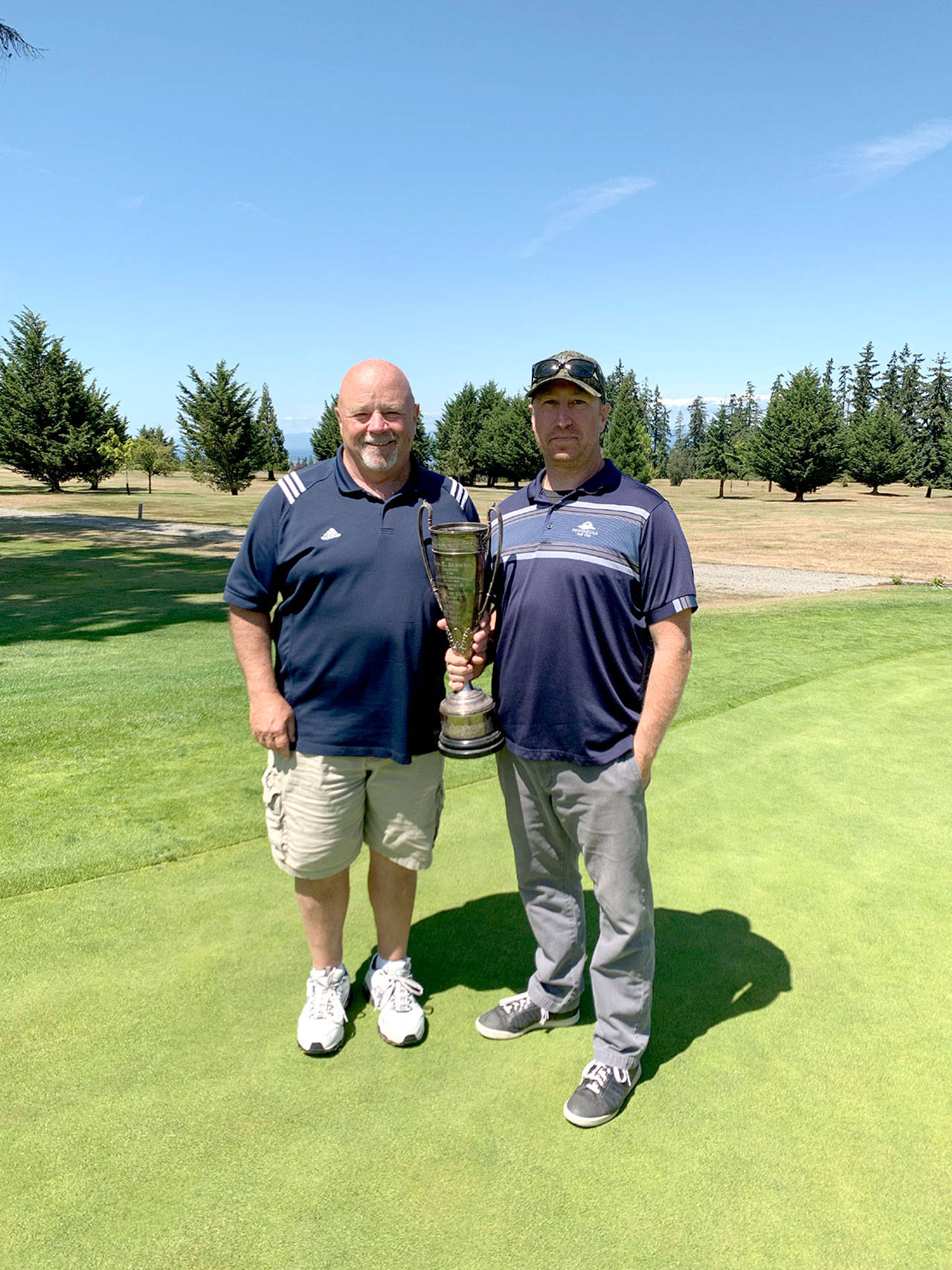 Peninsula Golf Club recently held its annual Men’s Club Championship and Paul Reed, left, and Mark Mast, won the Gross and Net championships, respectively and will share the Thomas T. Aldwell Trophy. It was the 12th club championship for Reed, the first for Mast.