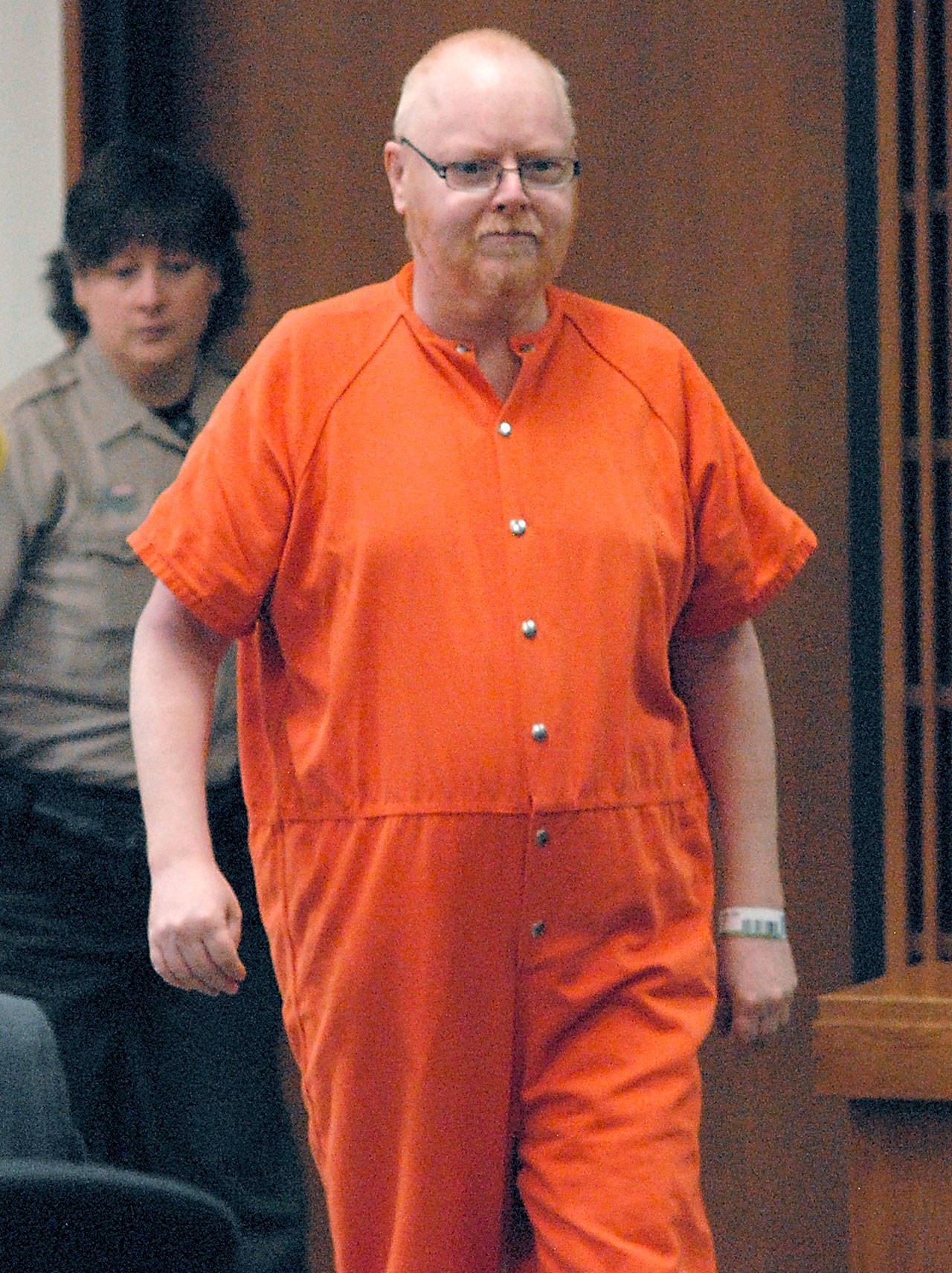 Digi Fre’nnson enters Clallam County Superior Court in Port Angeles on Thursday for sentencing on two counts of first-degree dealing in depictions of minors engaged in sexually explicit conduct and one count of first-degree possessing depictions of minors engaged in sexually explicit conduct. (Keith Thorpe/Peninsula Daily News)