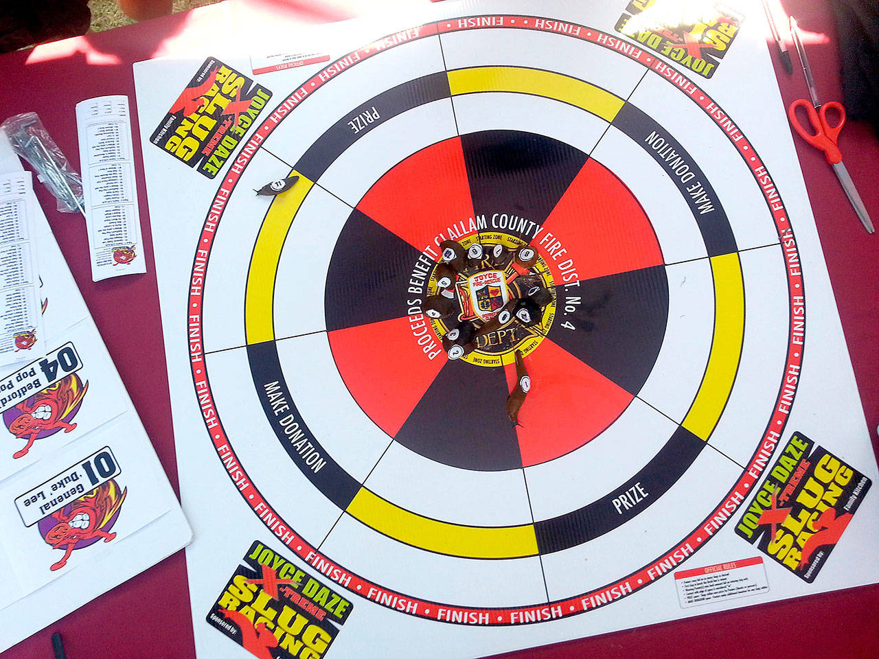 Sam Nugent Extreme Slug Racing’s No. 11 “Slippen Slyde” (upper left) looked like a sure winner moments before it made a sudden about-face and headed back to the center. Slug No. 1 “General ‘Duke’ Lee” (center top) then easily won the race in under 20 minutes.