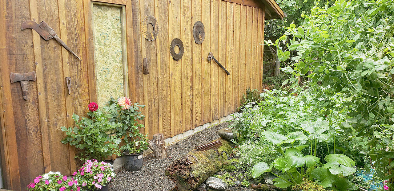 As in my kitchen garden, sometimes just adding relevant items can enhance the nuance of a planting or set a mood. (Andrew May)