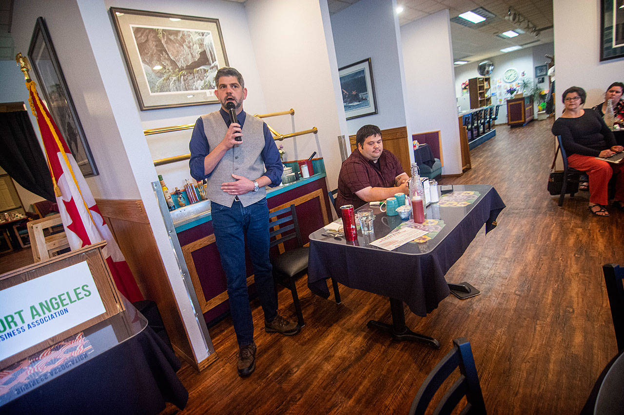 Incumbant Mark Ozias, left, and Brandon Janisse participate in a forum for Clallam County commissioner District 1 candidates at the Port Angeles Business Association meeting in Port Angeles on Tuesday. (Jesse Major/Peninsula Daily News)