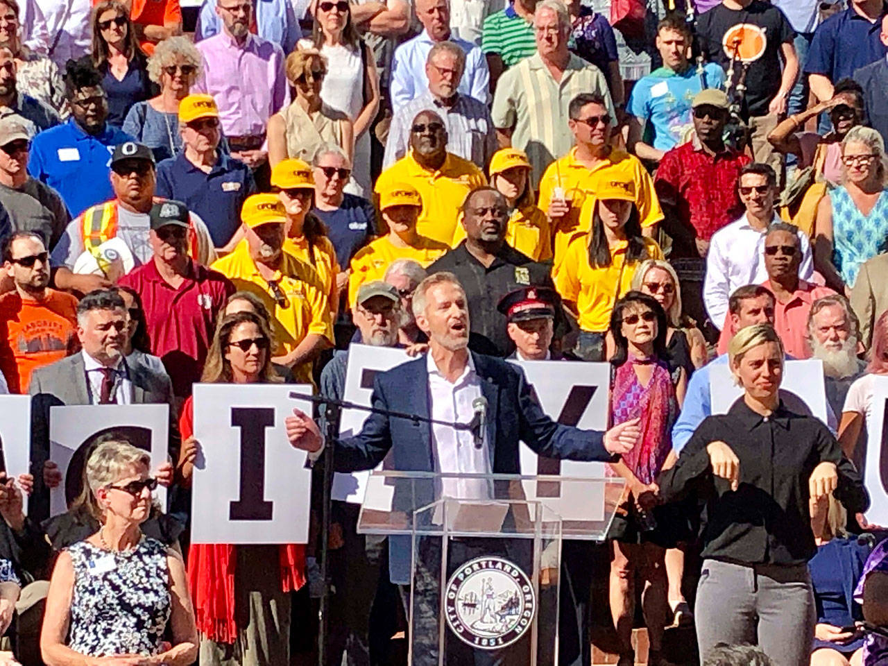 Portland, Ore., Mayor Ted Wheeler speaks during a rally Wednesday. (Gillian Flaccus/The Associated Press)