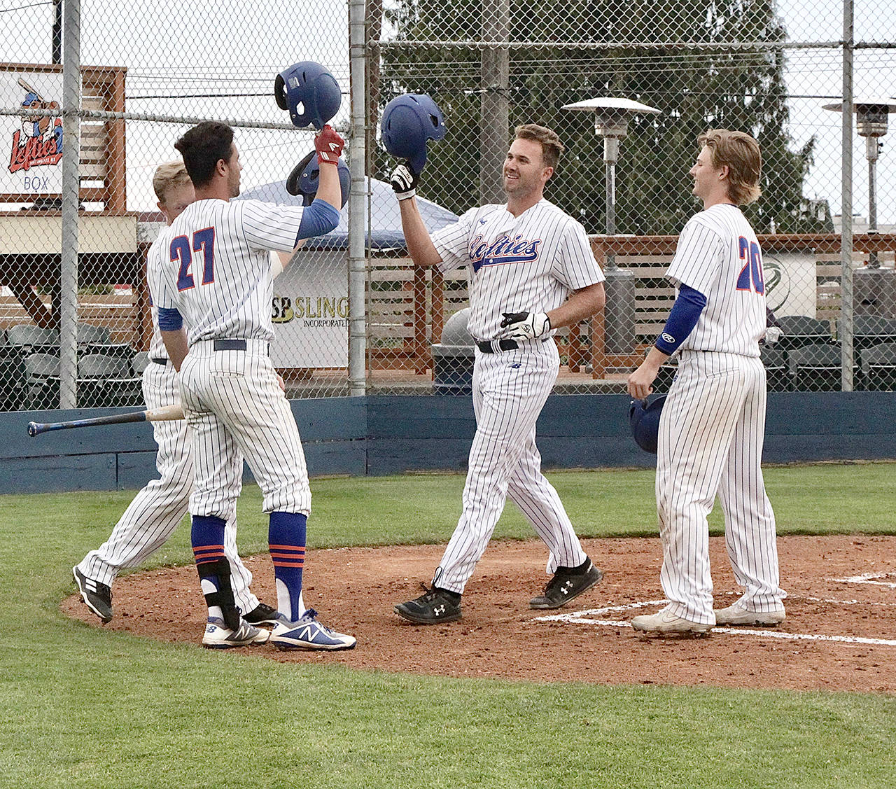 <strong>Dave Logan</strong>/for Peninsula Daily News The Lefties’ Matthew Christian, center, led the WCL with 12 home runs. He also slugged .711 on the season. The Campbell University senior was named to the All-WCL first team.