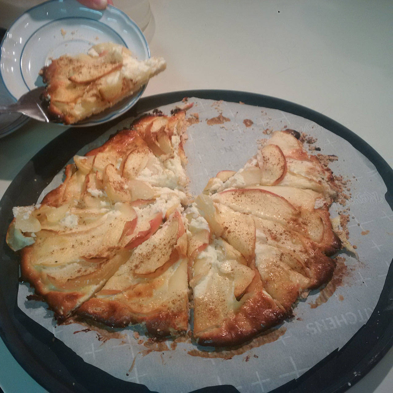 An apple and cream cheese galette is sliced for serving. (Emily Hanson/Peninsula Daily News)