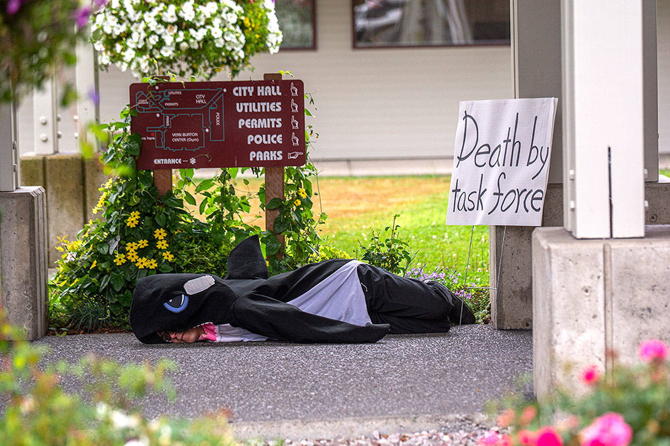 PHOTO: Port Angeles City Council member ‘stands’ up for orcas in protest