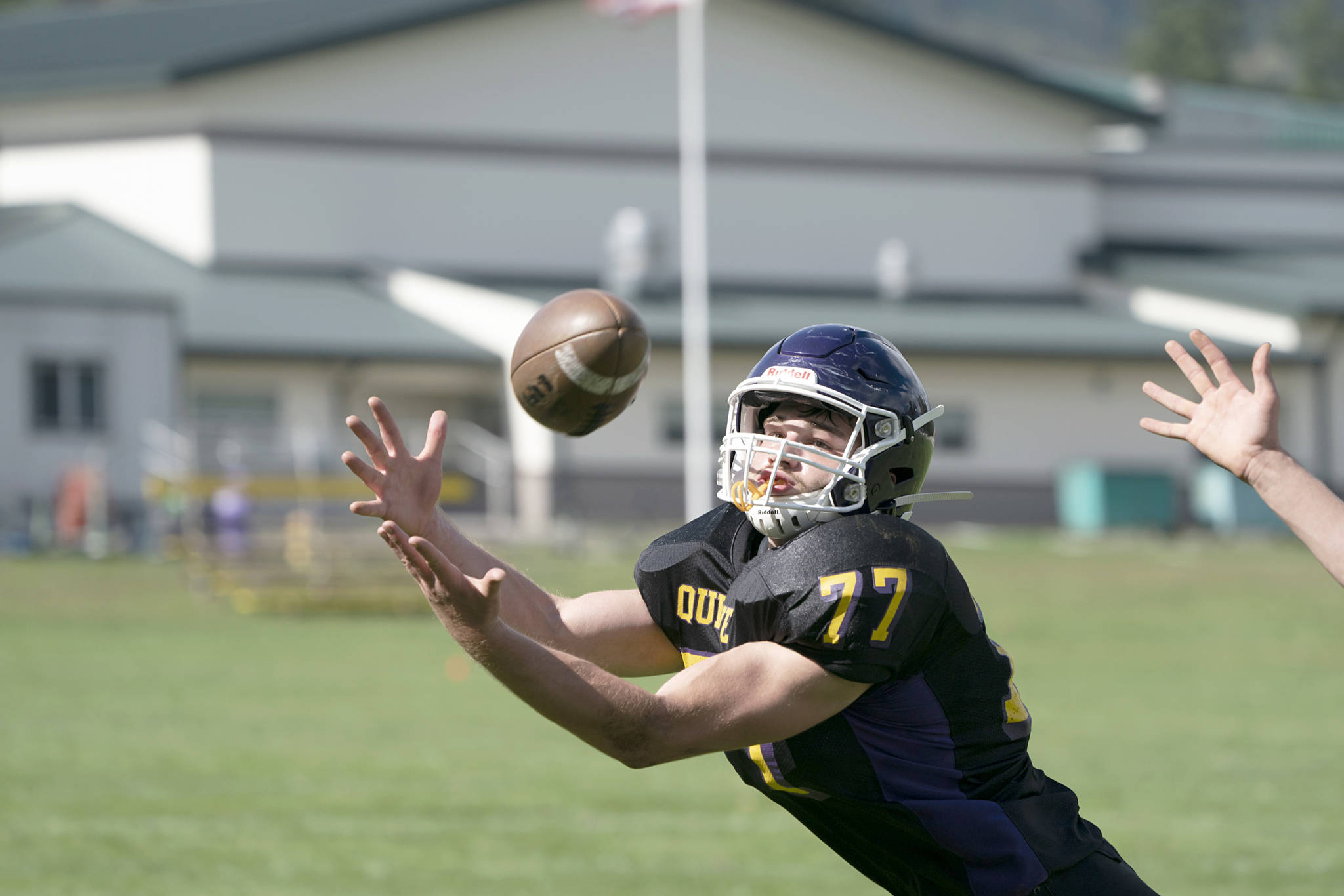 <strong>Steve Mullensky</strong>/for Peninsula Daily News Quilcene’s Zach Budnek dives for a pass during a game against Neah Bay on Saturday in Quilcene.