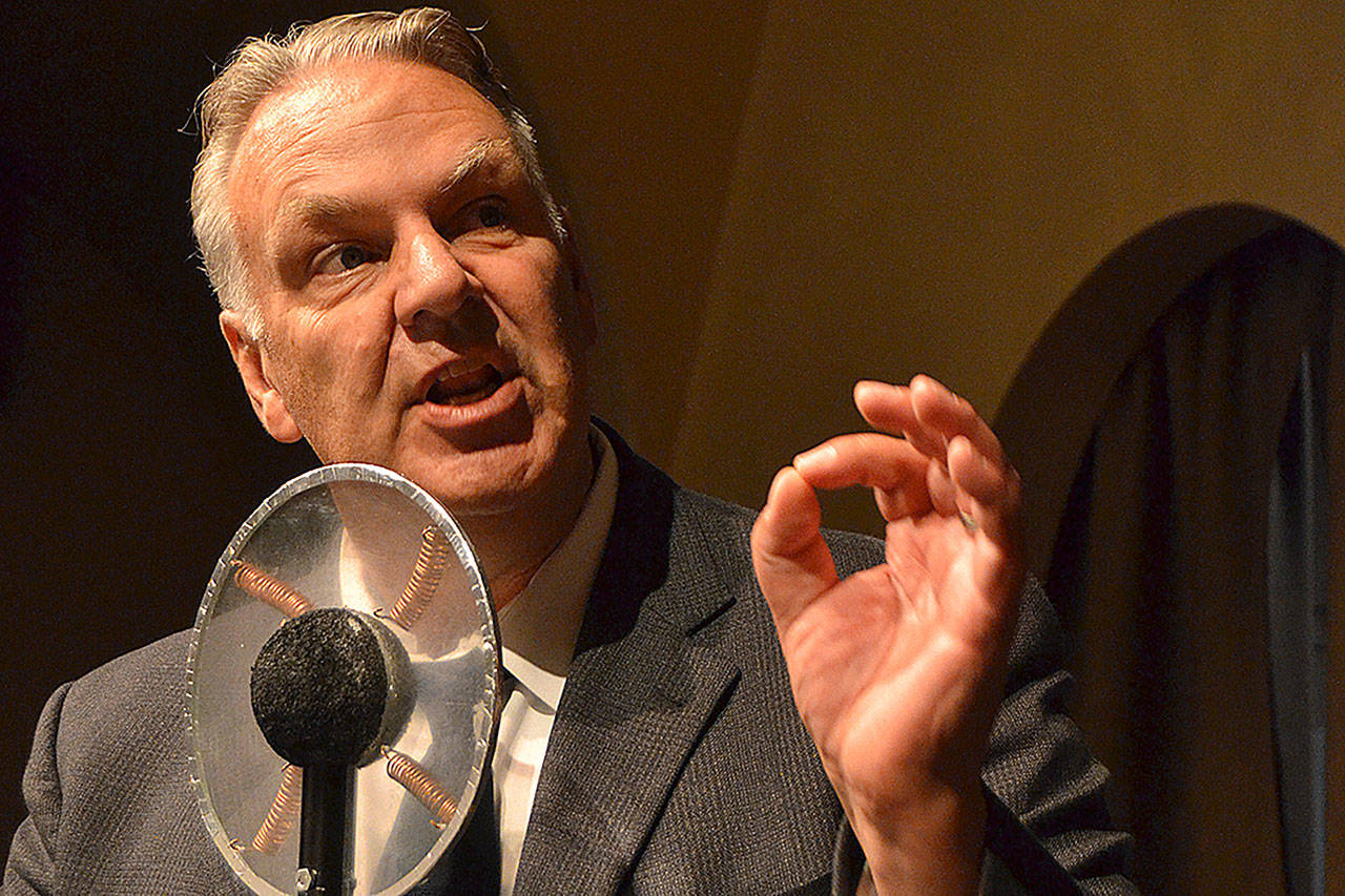 Mark Valentine narrates Orson Welles’ parts from the radio play “War of the Worlds.” Director Olivia Shea said the original play is recreated but with more audience interaction and emotion. (Matthew Nash/Olympic Peninsula News Group)