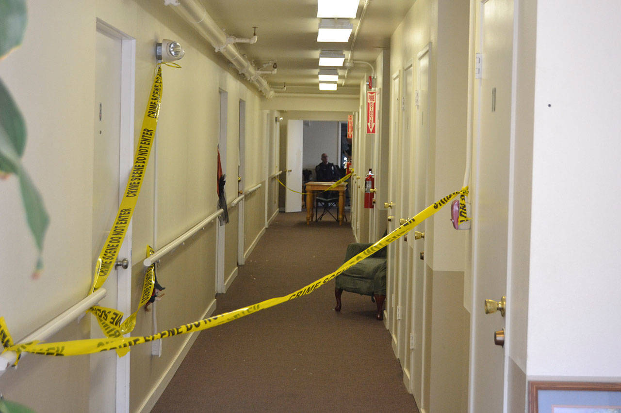 Residents of Sunbelt Apartments remain on site Tuesday as State Patrol troopers conduct an investigation of the crime scene after a resident allegedly attempted to kill her neighbor. (Matthew Nash/Olympic Peninsula News Group)