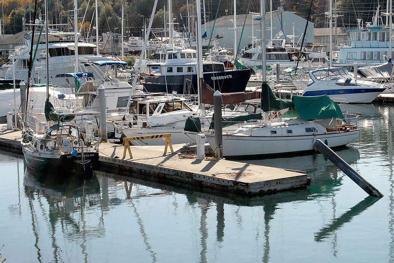 A barracade marks the temporary end of the G-H Dock at Port Angeles Boat Haven on Thursday after a runaway Westport yacht damaged several pontoons and six other boats Monday. (Keith Thorpe/Peninsula Daily News)