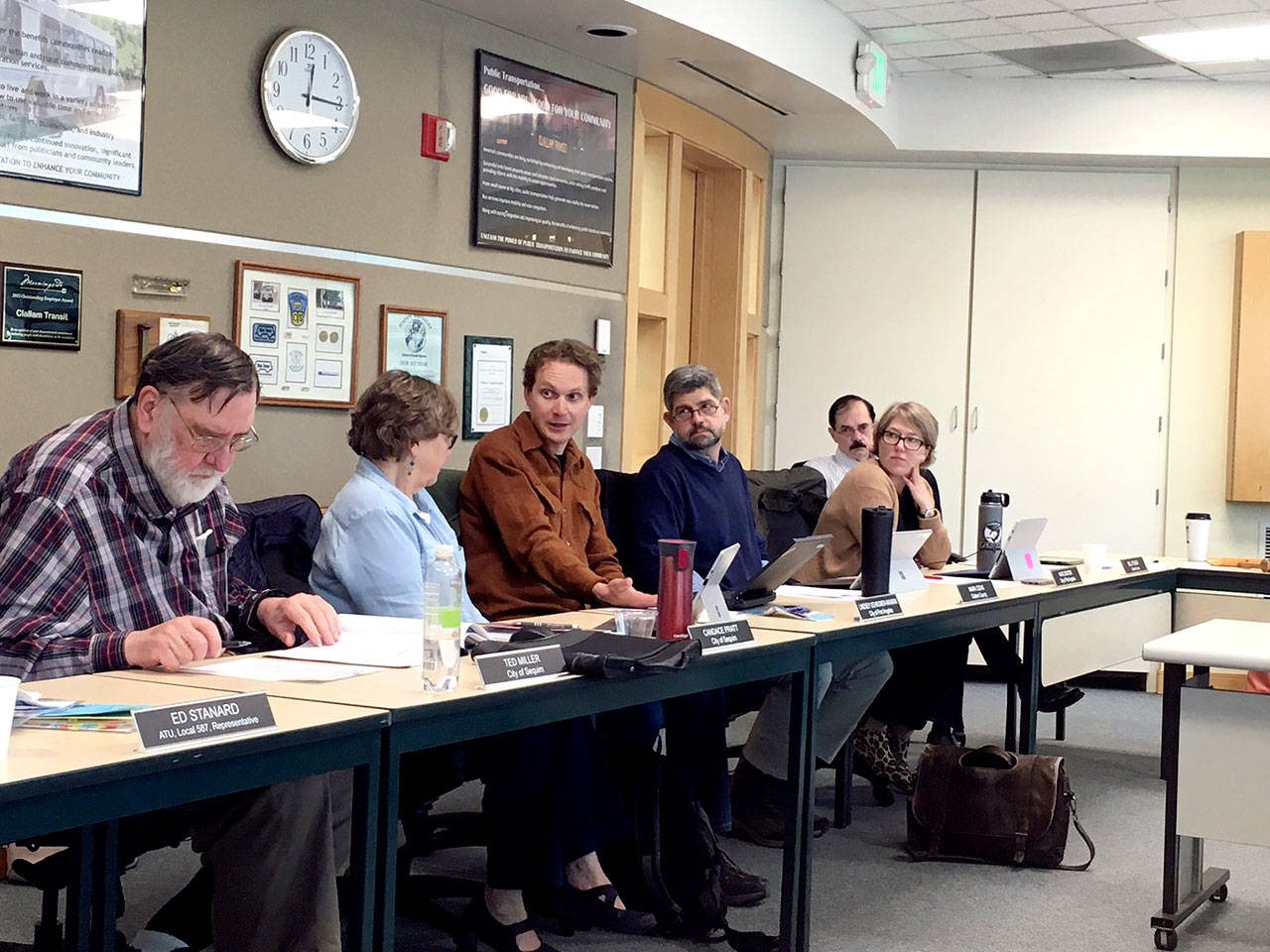 Clallam Transit board members, from left, Ted Miller, Candace Pratt, Lindsey Schromen-Wawrin, Mark Ozias, Kate Dexter and Bill Peach discuss potential impacts of state Initiative 976. (Rob Ollikainen/Peninsula Daily News)