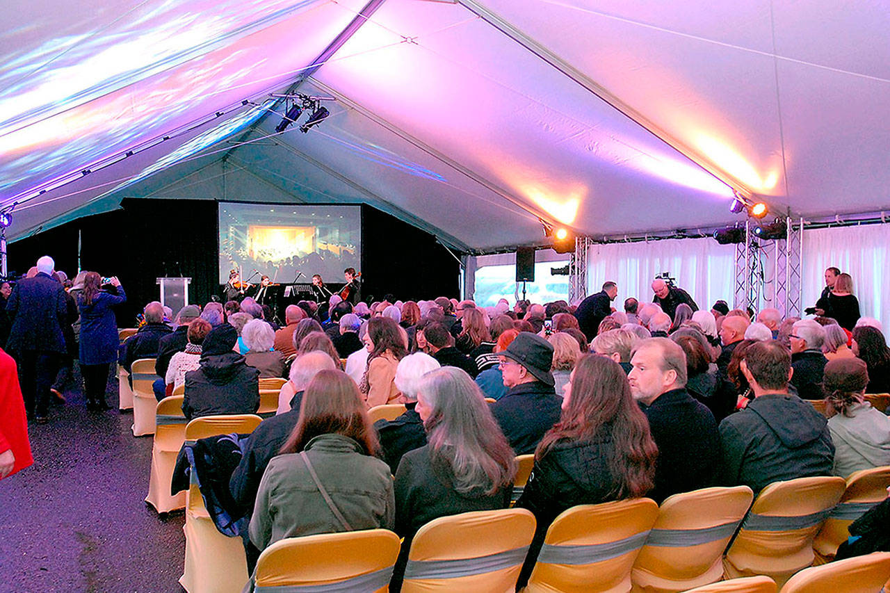 Groundbreaking audience members listen to the Port Angeles High School String Quartet perform warm-up music prior to the start of Friday night’s festivities. (Keith Thorpe/Peninsula Daily News)