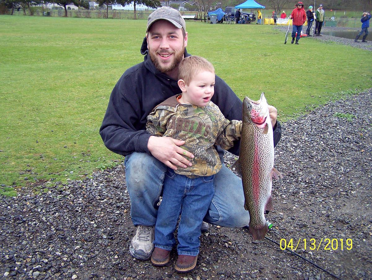 Kyle Helland and his son Everett caught this rainbow trout in Sequim’s Carrie Blake Park Pond last spring. The pond will soon receive a plant of large rainbow trout for fall fishing opportunities for ages 14 and younger.