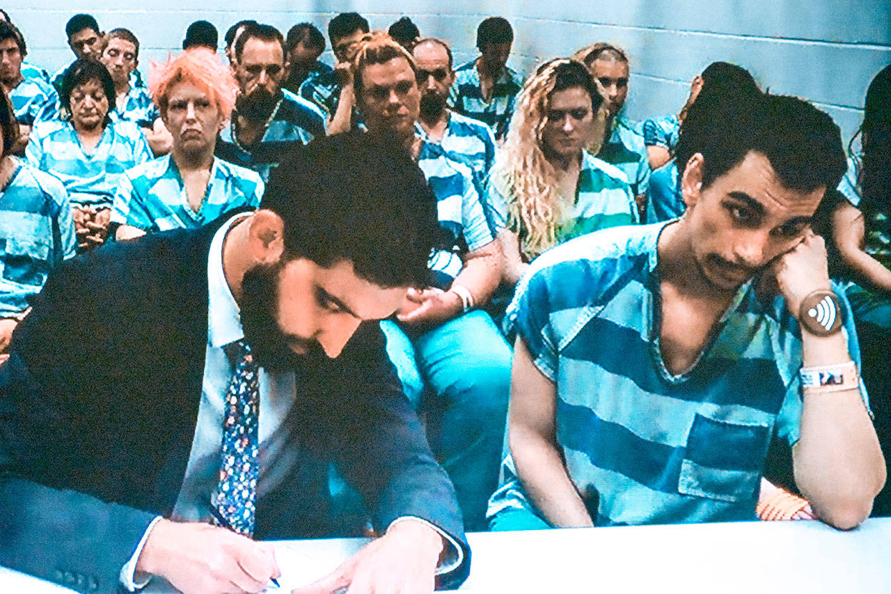 Zachary Madding, right, was sentenced Wednesday in Snohomish County Superior Court to two years and five months in prison. (Caleb Hutton/Everett Herald file)