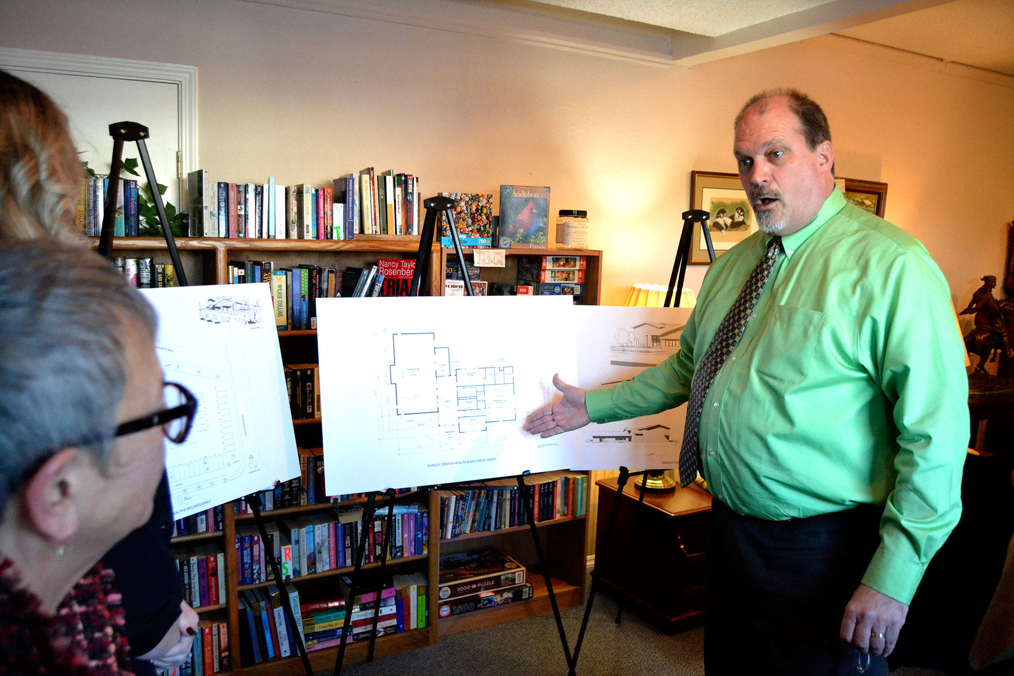 <strong>Matthew Nash</strong>/Olympic Peninsula News Group Michael Smith, executive director of the Shipley Center, discusses plans for the center’s Health & Wellness Annex with Jan Simon, executive director of the First Federal Community Foundation, and Ashley Slezak, First Federal Sequim market manager. Smith said the proposed $1.5 million project will add about 6,400 square feet of space for exercise classes, a fitness room, sports courts, a commercial demonstration kitchen and more.