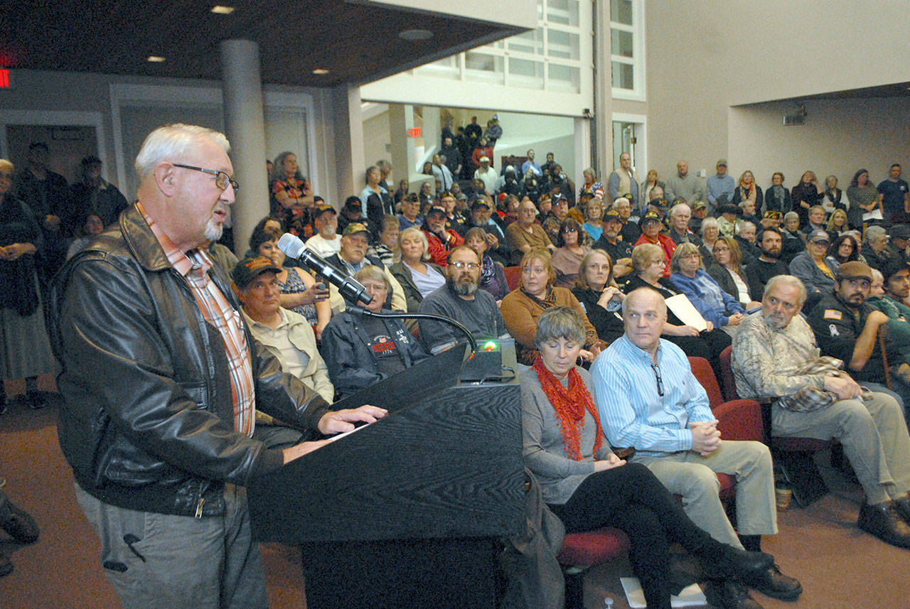 Gary Velie, president of the Clallam County Veterans Association, speaks out against changing the silhouetted soldiers that adorn a recently installed fence that protects the Liberty Bell replica in Veterans Memorial Park during a public comment portion of Wednesday night’s meeting of the Port Angeles City Council. (Keith Thorpe/Peninsula Daily News)