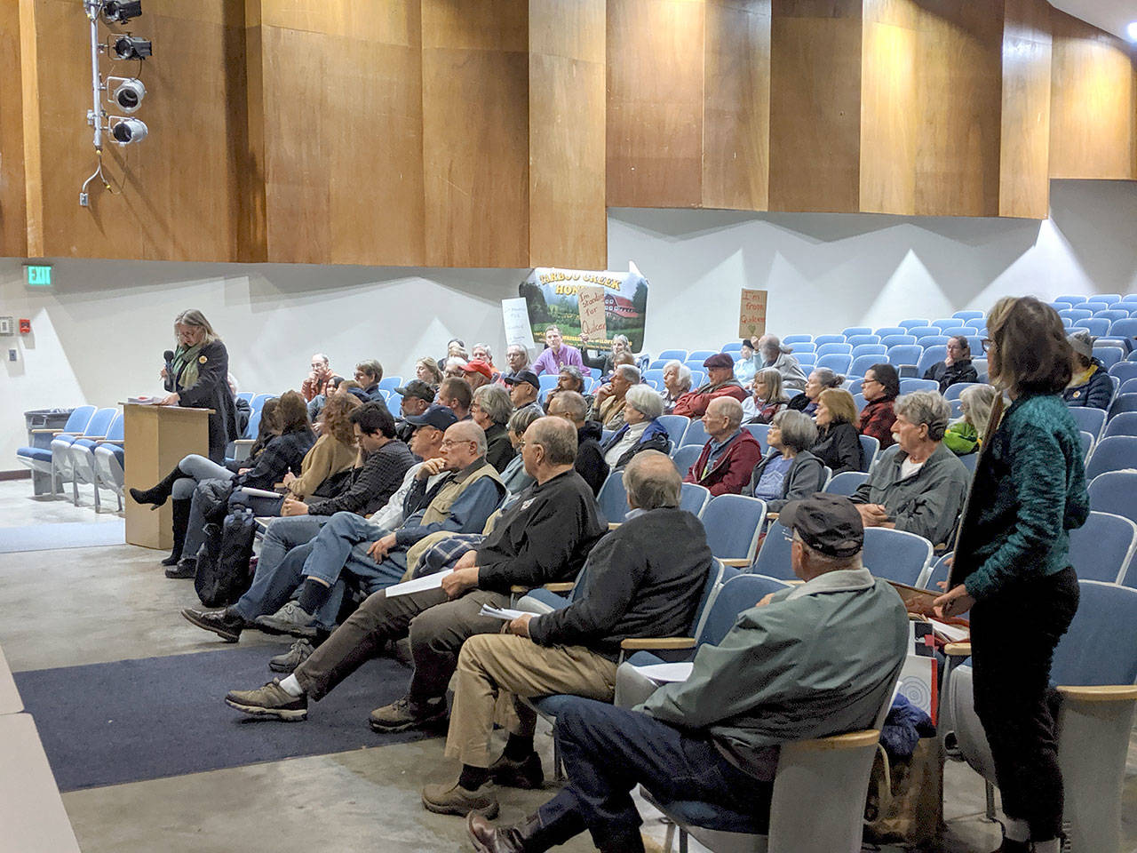 Lela Hilton presents a petition by the Tarboo Ridge Coalition, which was said to be signed by over 1,000 people asking for “bright line” regulations in regard to shooting ordinances. (Zach Jablonski/Peninsula Daily News)