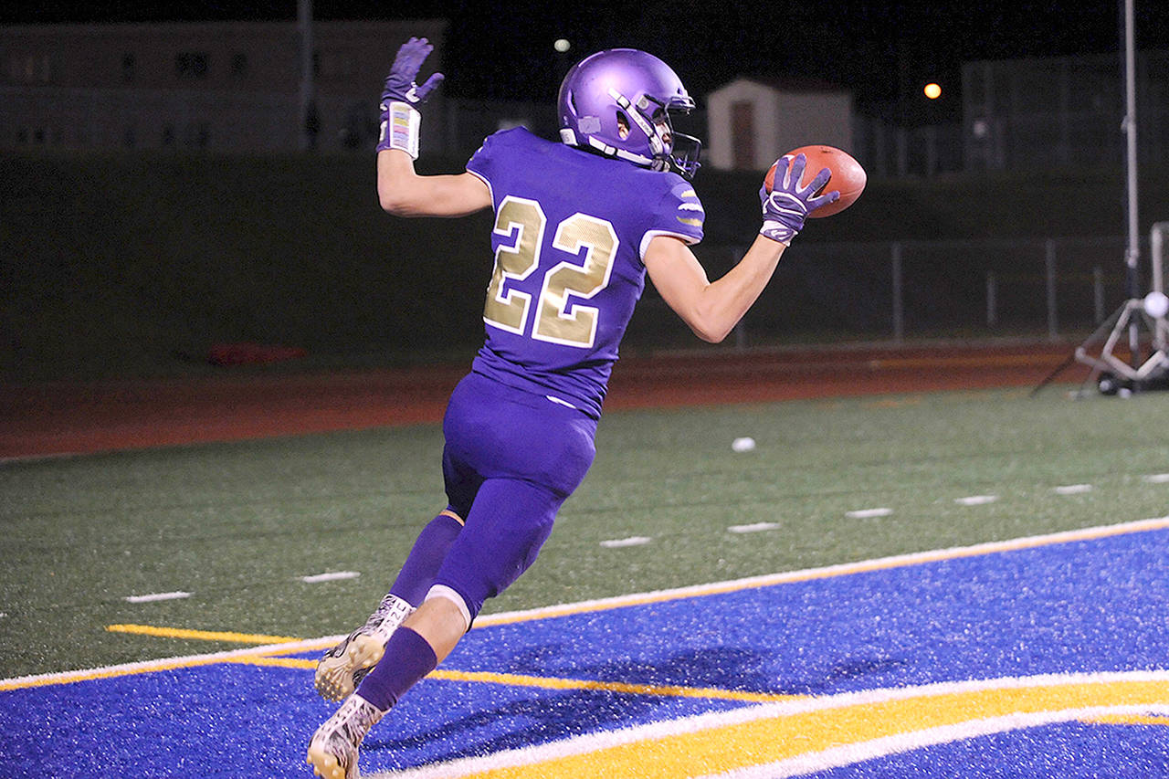 Conor Dowley/Olympic Peninsula News Group Sequim’s Walker Ward celebrates after scoring a touchdown off a screen pass last week against River Ridge.