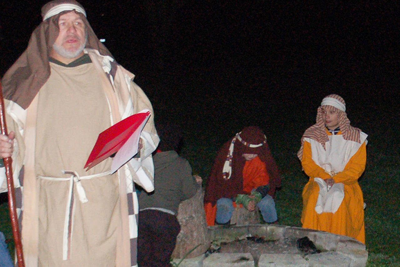 Pastor Jerry Luengen, left, practices his role as Josaiah in a Nov. 20 dress rehearsal for the Sequim Valley Nazarene Church living Nativity performance. The Nativity will be performed four times each night at the church Dec. 6-8. (Conor Dowley/Olympic Peninsula News Group)