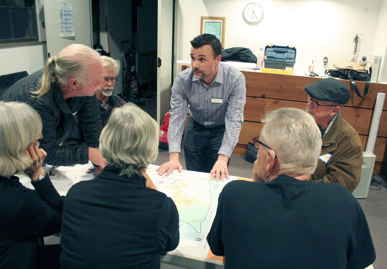 Alex Wisniewski, the director of Port Townsend’s parks, recreation and community services department, leads a group discussion at the Cotton Building. Wisniewski and other group facilitators asked the public where gaps currently exist in the city’s parks inventory. (Brian McLean/Peninsula Daily News)