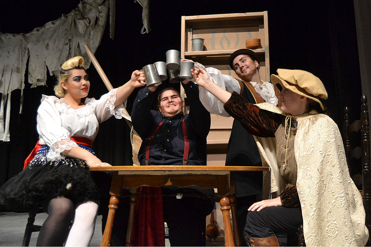 Friends, from left, Feste the Fool (Erin Quintero), Sir Toby (Kenzie Camp), Sir Andrew (Kaylee Dunlap) and Fabian (Jennessa Robinson) celebrate together in Shakespeare’s “Twelfth Night.” Below, Gloria Barrera Reyna as Antonieta helps Kyle DeSumma’s Sebastian regain his footing after he was thought lost at sea. Sequim Gazette photos by Matthew Nash