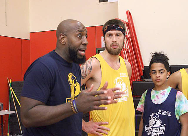 Port Angeles Rams head coach Gerrad Brooks speaks to his team, including Darryl Svec, during a recent practice. The Rams visit the Peninsula College men at 4 p.m. Saturday. (Port Angeles Rams)