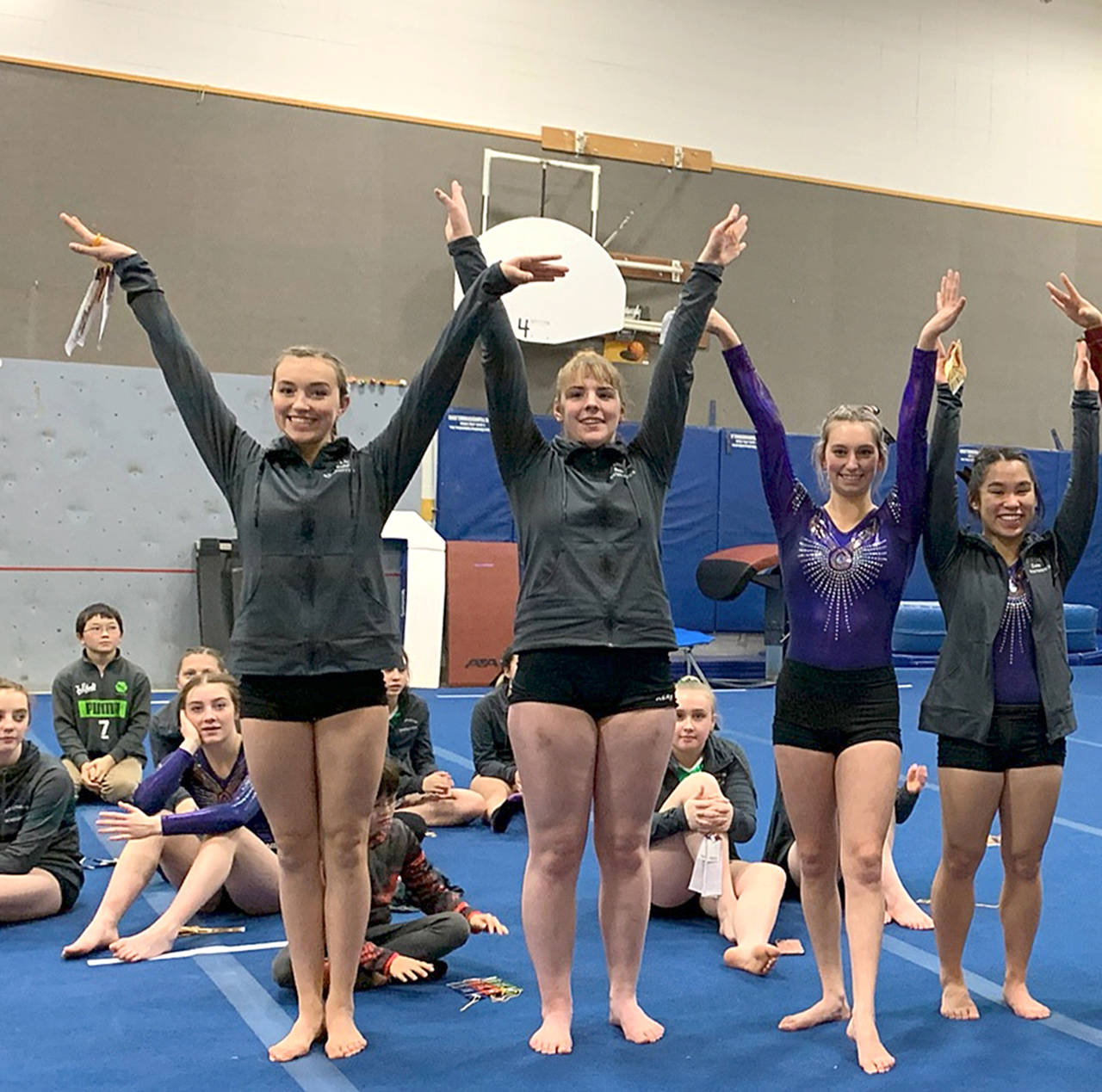 All-around winners from Friday’s gymnastics win over Kingston are, from left, Sequim’s Gracie Sharp, Port Angeles’ Aiesha LaTourette, Sequim’s Emma Sharp and Sequim’s Lesae Pfeffer. (Jackie Mangano)