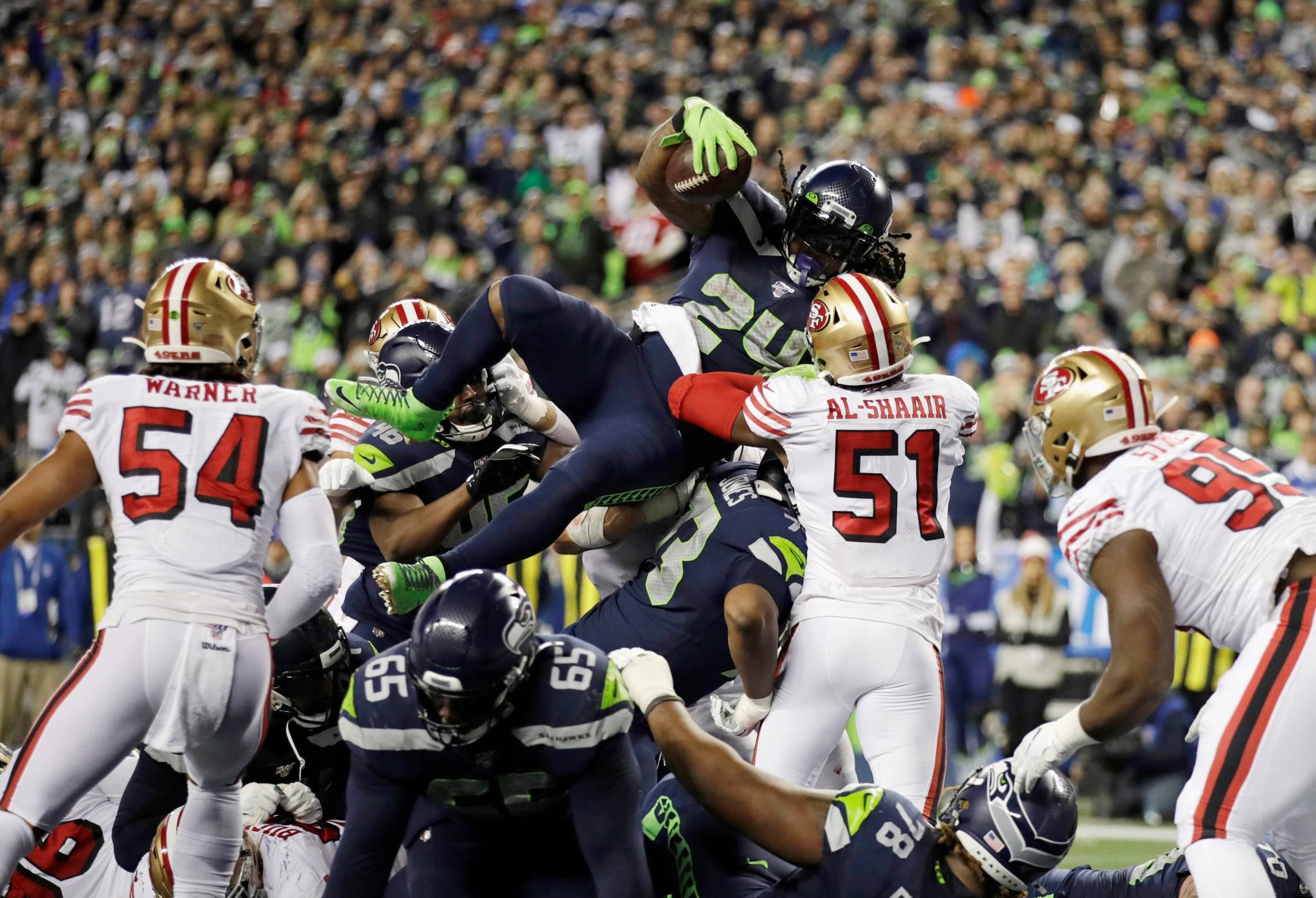 Seattle Seahawks’ Marshawn Lynch (24) scores a touchdown on a 1-yard rush against the San Francisco 49ers during the second half of an NFL football game, Sunday, Dec. 29, 2019, in Seattle. (AP Photo/Stephen Brashear)