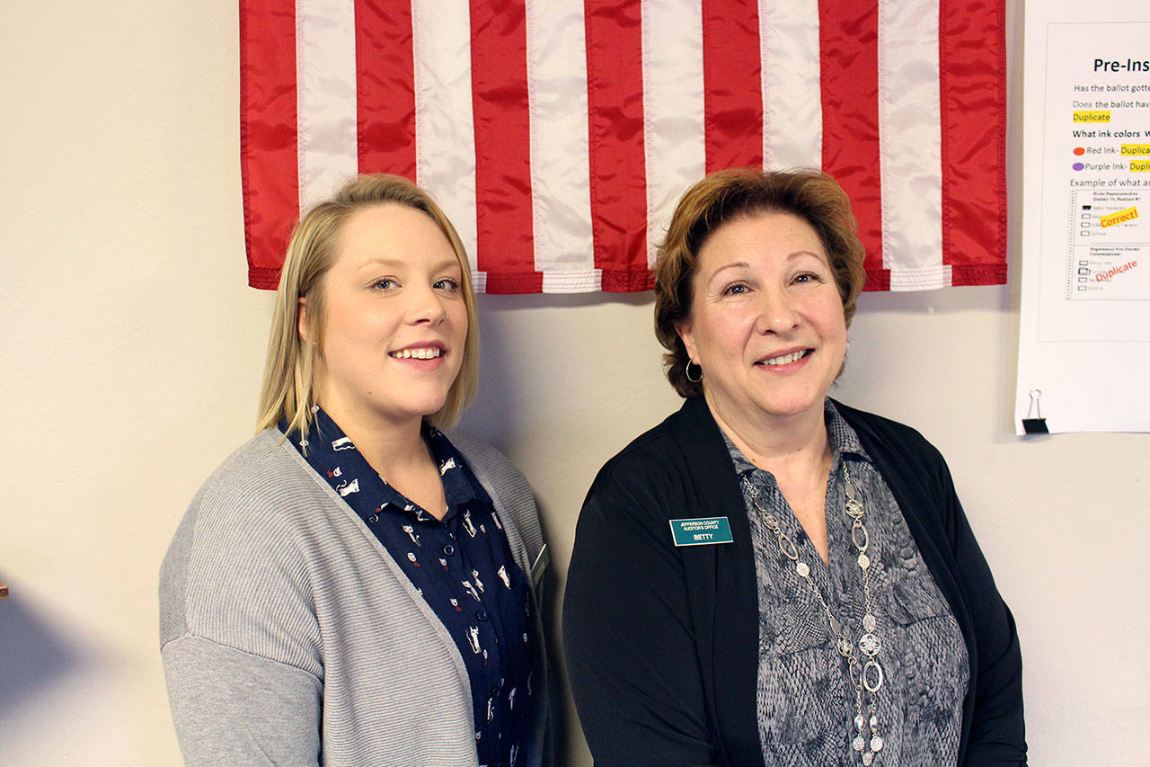 The new Jefferson County Election Coordinator Quinn Grewell stands with the now retired election coordinator Betty Johnson on Monday in the Auditor’s Office of the Jefferson County Courthouse. Johnson retired after working for the county on the election team for 25 years, the last six serving as the election coordinator. (Zach Jablonski/Peninsula Daily News)