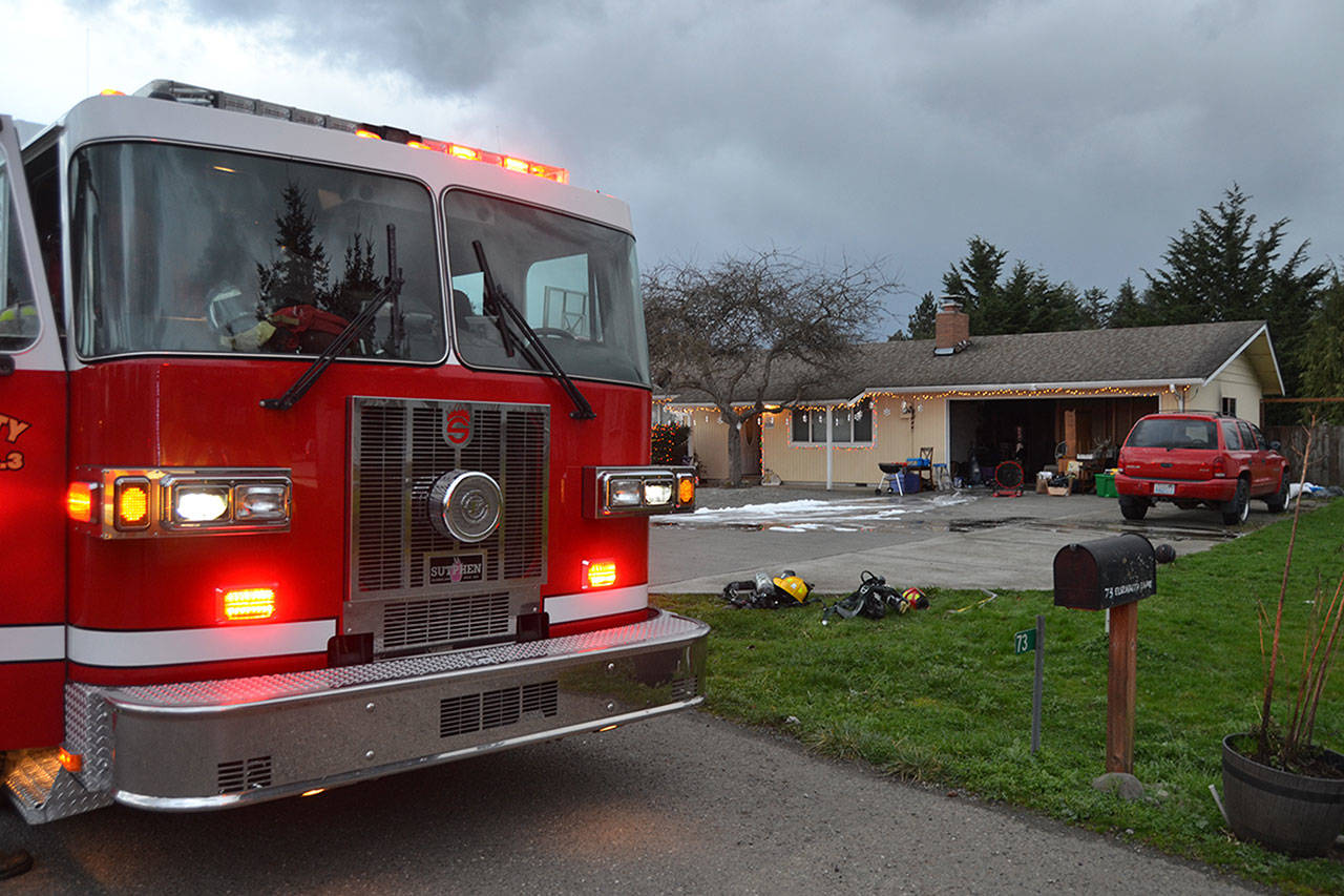 <strong>Matthew Nash/</strong>Olympic Peninsula News Group Clallam County Fire District 3 personnel extinguished a garage fire.