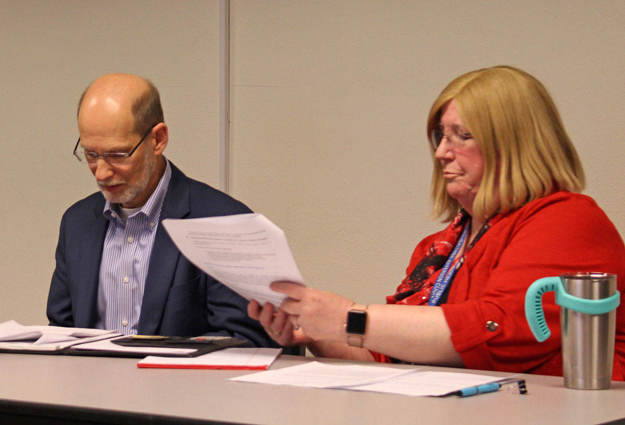 Jefferson County Administrator Philip Morley sits with County Public Health Director Vicki Kirkpatrick on Monday as they give a presentation to the county commissioners. (Zach Jablonski/Peninsula Daily News)